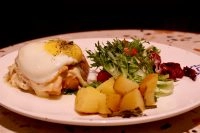 a white plate topped with food and vegetables